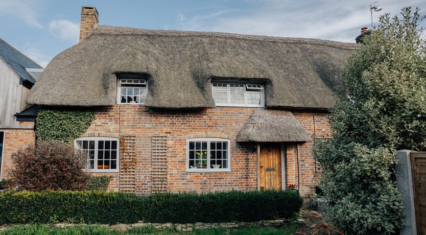 Photo of Thatched Roof Romance