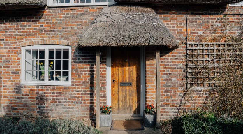 Photo of Thatched Roof Romance