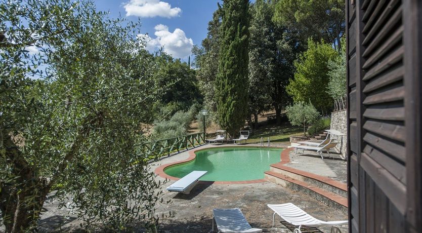 Photo of Brick & Green Shutters