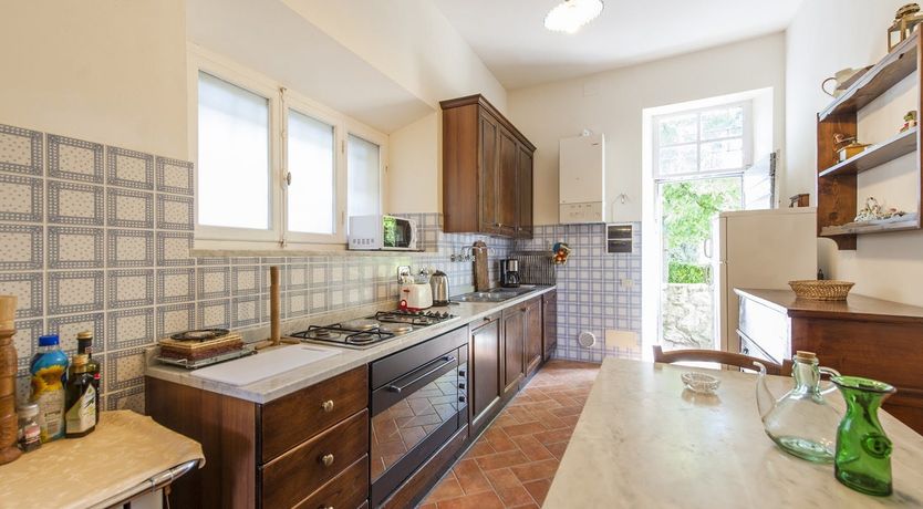 Photo of Brick & Green Shutters