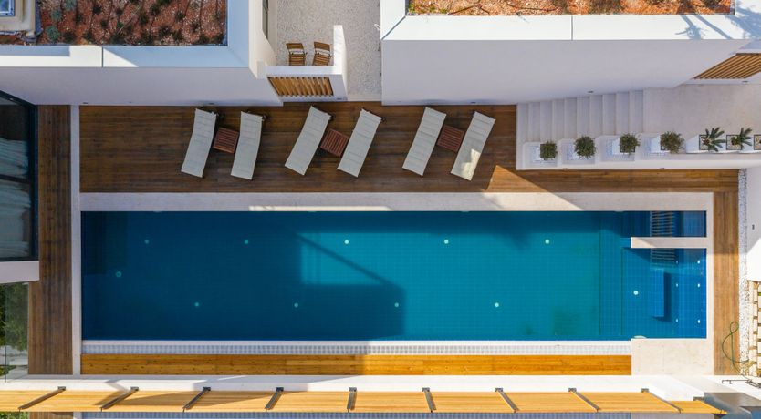 Photo of White Walls & Blue Skies