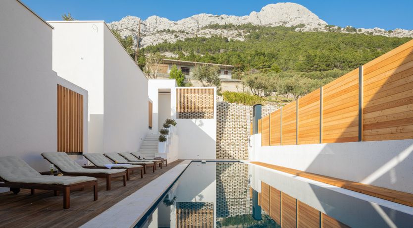 Photo of White Walls & Blue Skies