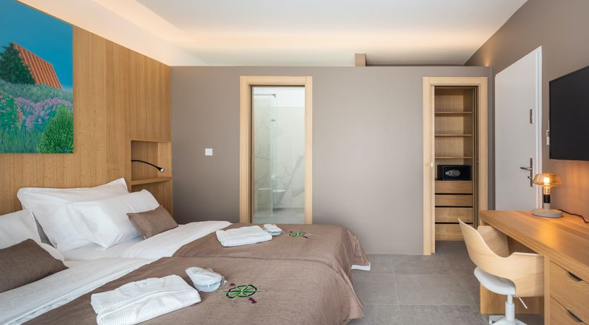 Photo of White Walls & Blue Skies