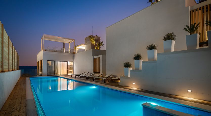 Photo of White Walls & Blue Skies