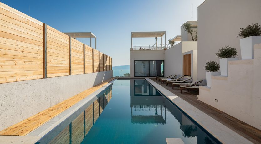 Photo of White Walls & Blue Skies