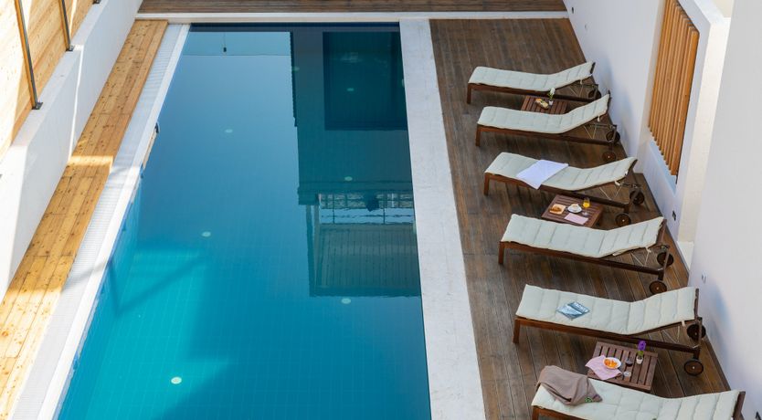 Photo of White Walls & Blue Skies