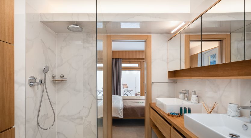 Photo of White Walls & Blue Skies