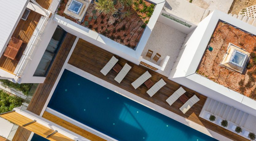 Photo of White Walls & Blue Skies