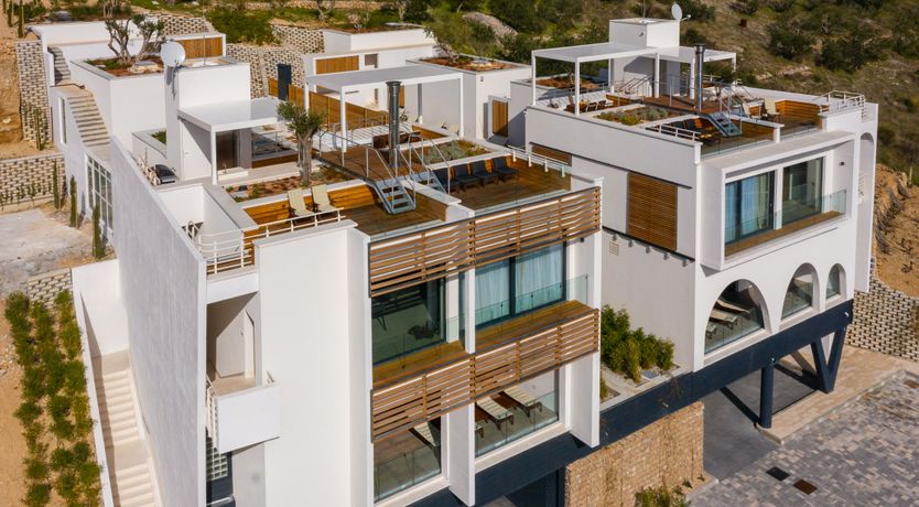 Photo of White Walls & Blue Skies