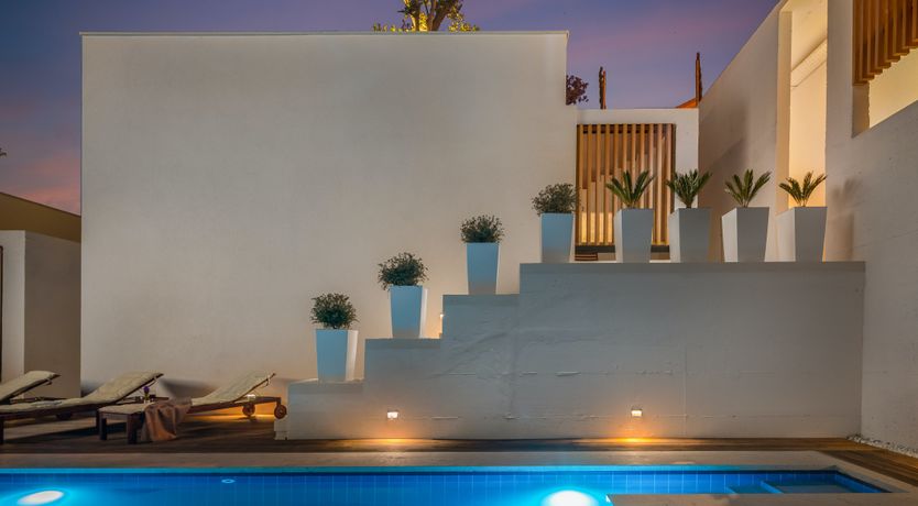 Photo of White Walls & Blue Skies