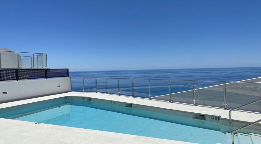 Photo of Over the Glass Balcony