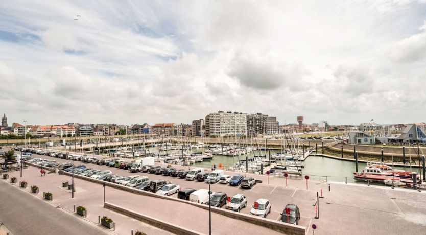 Photo of Bella I with parking and harbour view