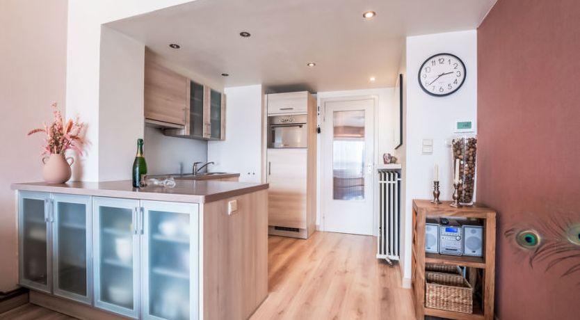 Photo of Bella I with parking and harbour view