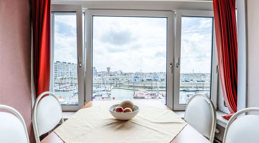 Photo of Bella I with parking and harbour view