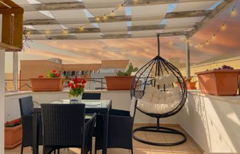 A Rooftop Sunset Holiday Home